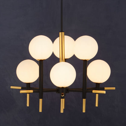 Modern chandelier with six round glass lights on a dark background