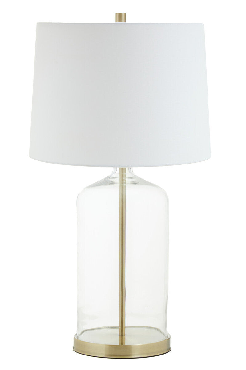 Table lamp with white shade and brass base on a white background
