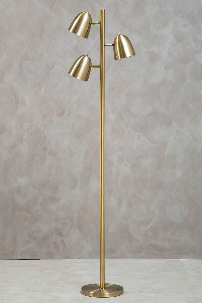 Gold floor lamp with three adjustable lights against a gray background