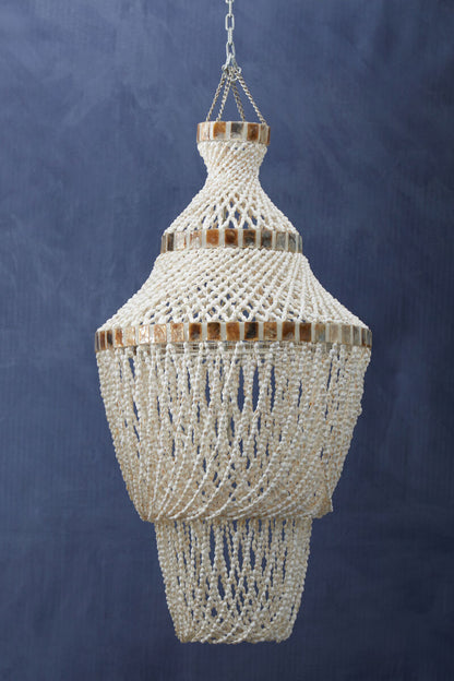 Decorative beaded chandelier against a dark blue background