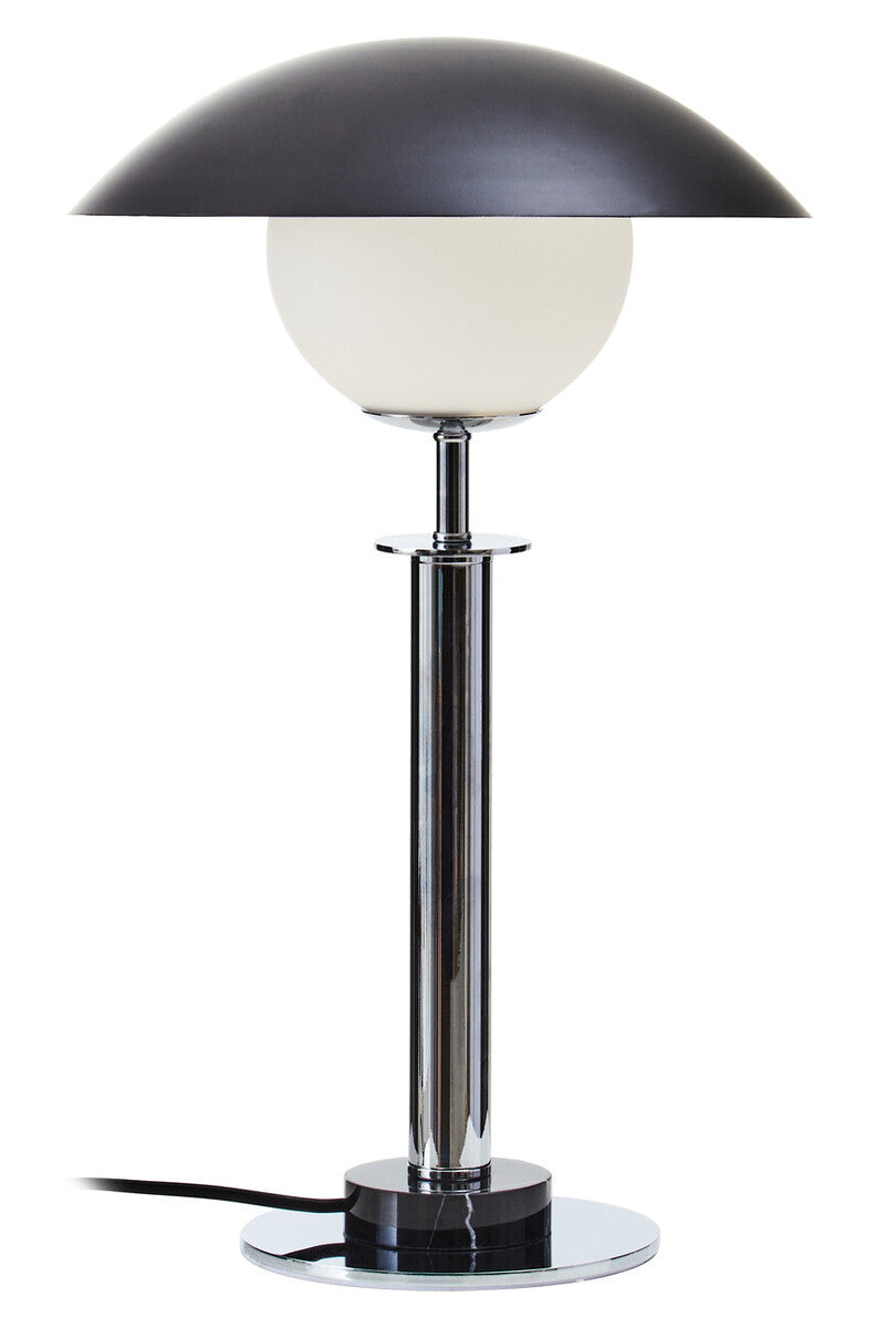Table lamp with black shade and white glass base on a white background