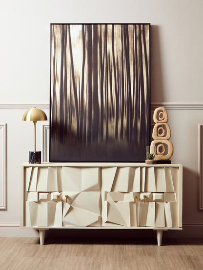 Modern interior with a textured sideboard, abstract painting, and decorative items.