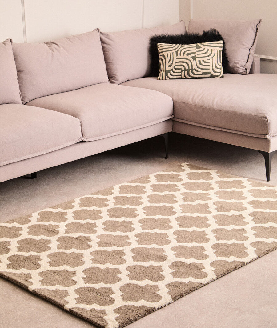 Sectional sofa with patterned cushions in a living room setting