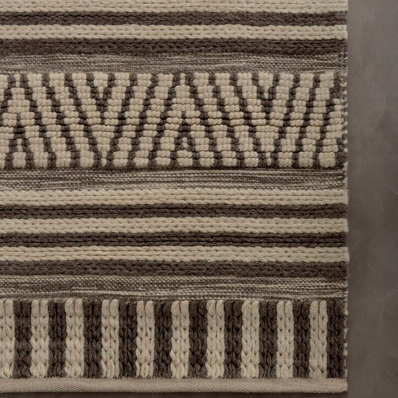Textured area rug with geometric pattern on a gray background
