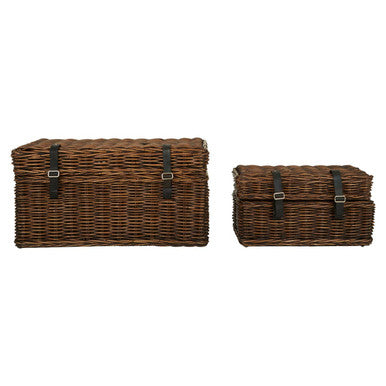 Two brown woven storage baskets with black straps on a white background