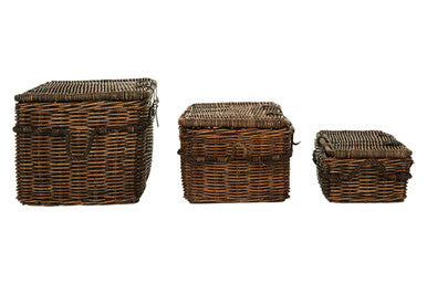 Three wicker baskets of different sizes on a white background
