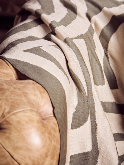 Patterned fabric draped over a textured surface