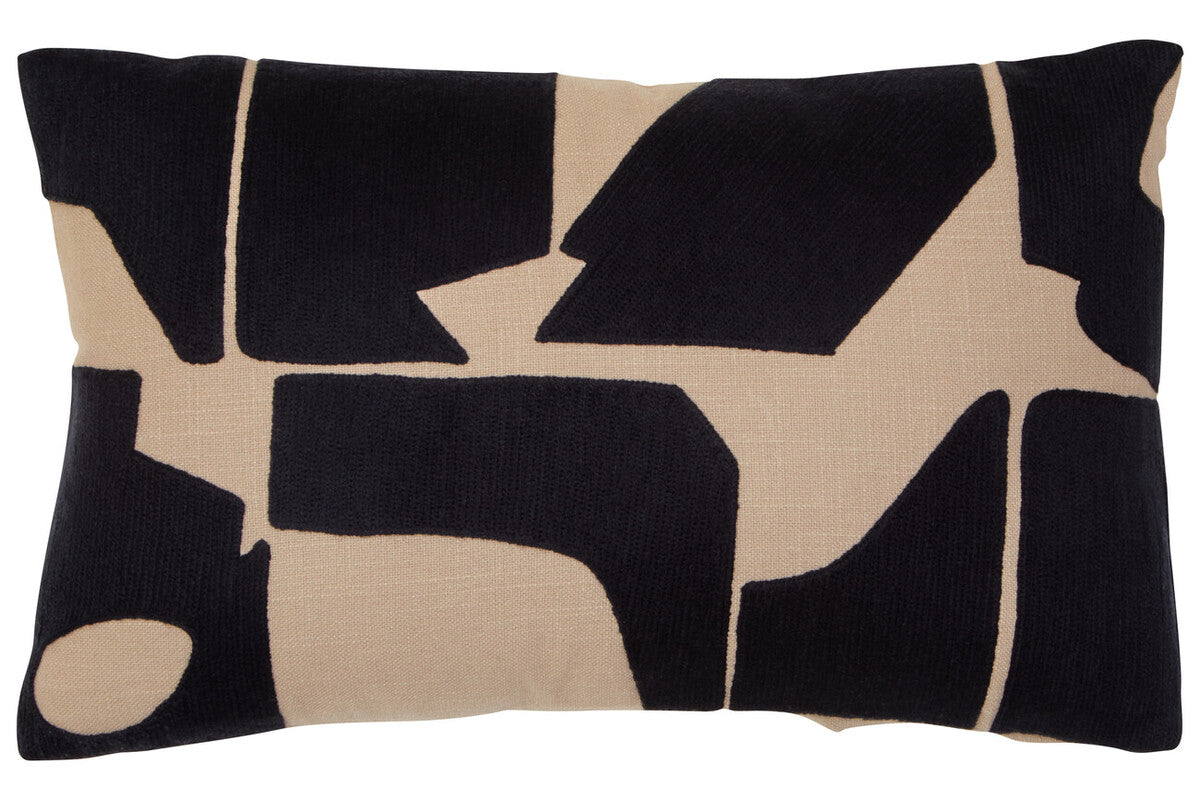 Decorative pillow with black and beige abstract pattern on a white background