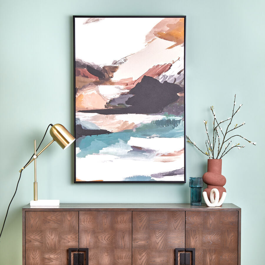 Wooden sideboard with decorative items against a light blue wall