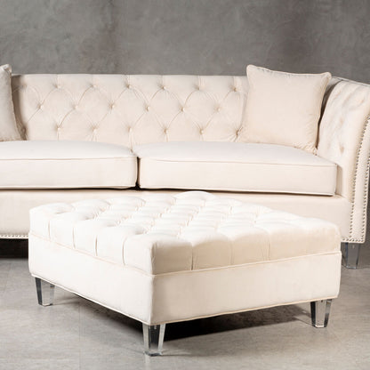 Beige tufted sofa with matching ottoman on a gray background