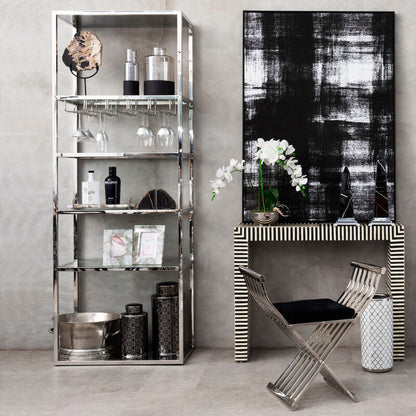Modern interior with metallic shelving units and a console table.
