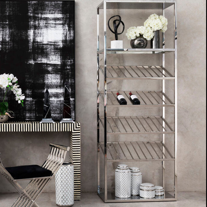 Modern interior with metallic shelving units and a console table.