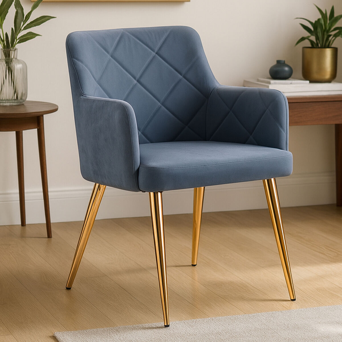 Blue upholstered chair with gold legs in a room setting