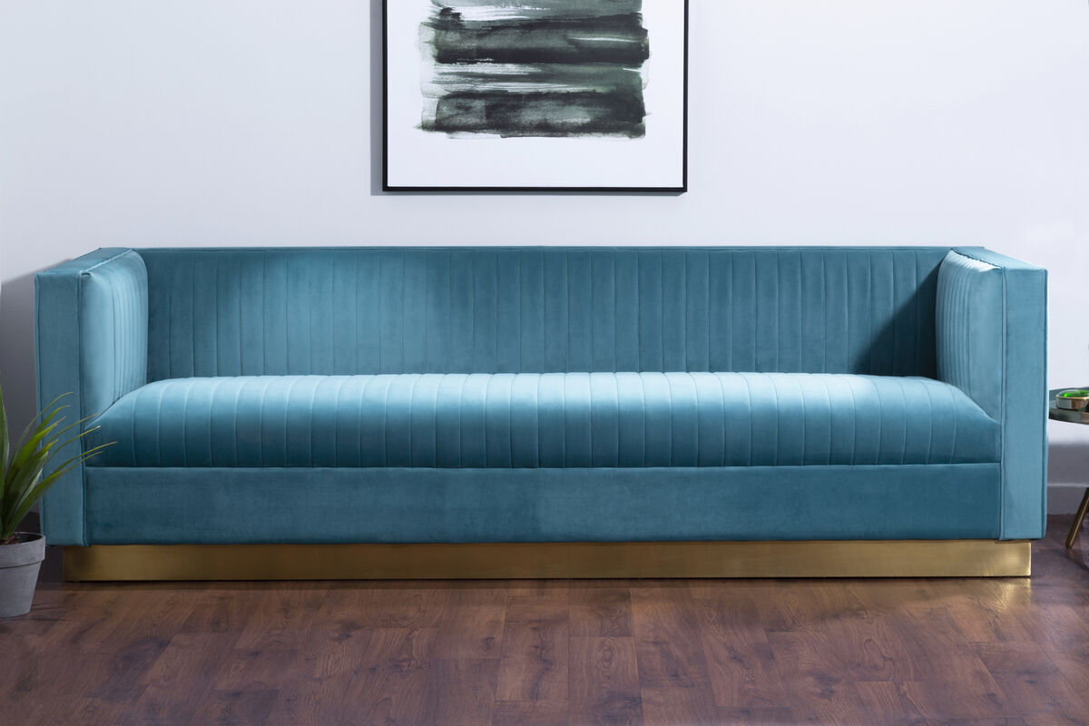 Blue sofa in a room with a abstract painting on the wall