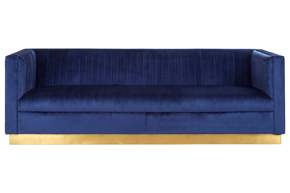 Blue velvet sofa with a gold base on a white background