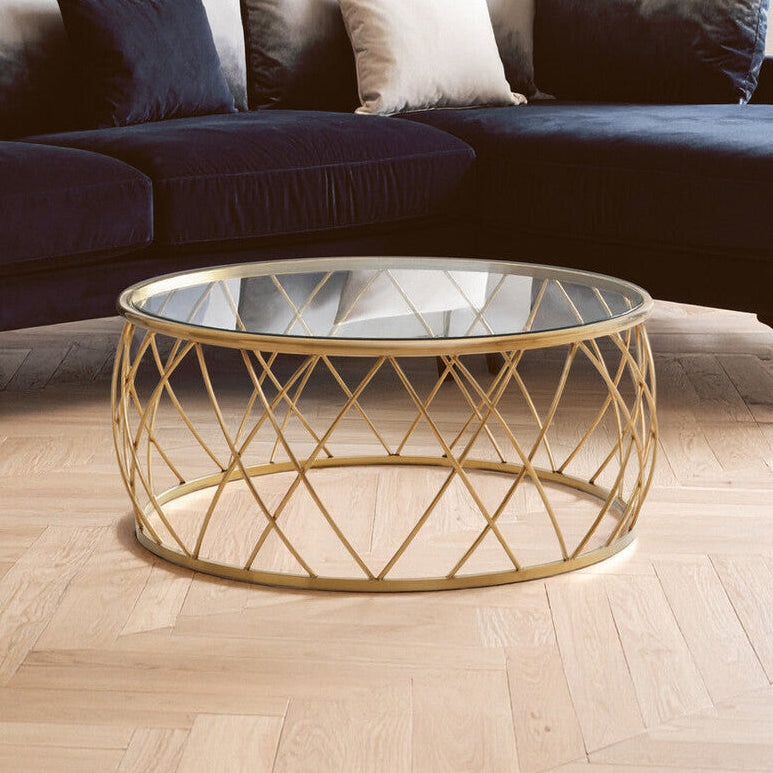 Shop Ackley Gold Round Coffee Table with Clear Glass from Orsina