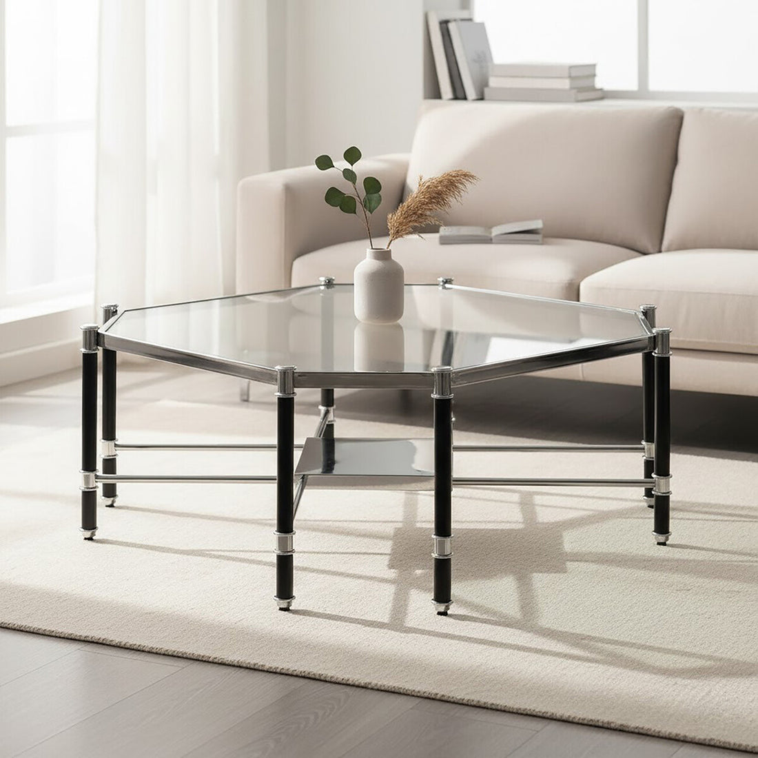 Glass coffee table with black metal frame in a living room setting.
