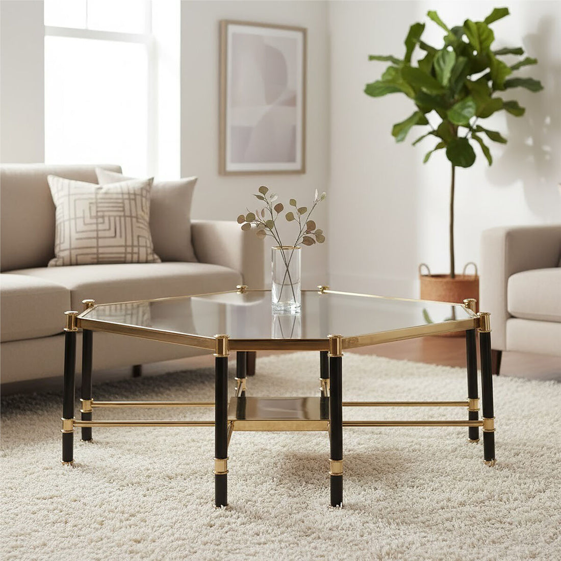 Modern living room with a glass coffee table, sofa, and plant.