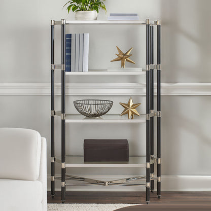 Glass shelf unit with decorative items against a neutral wall
