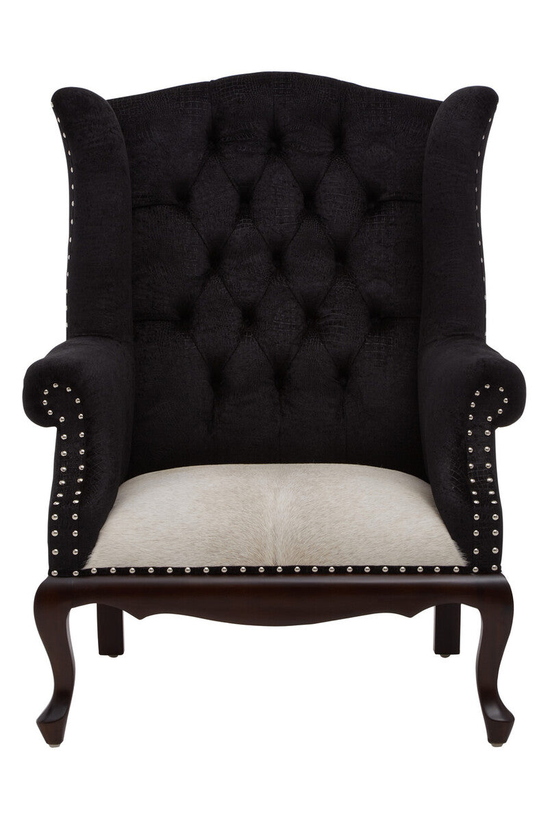 Black tufted armchair with white cushion on a white background