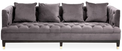 Gray tufted sofa with four cushions on a white background