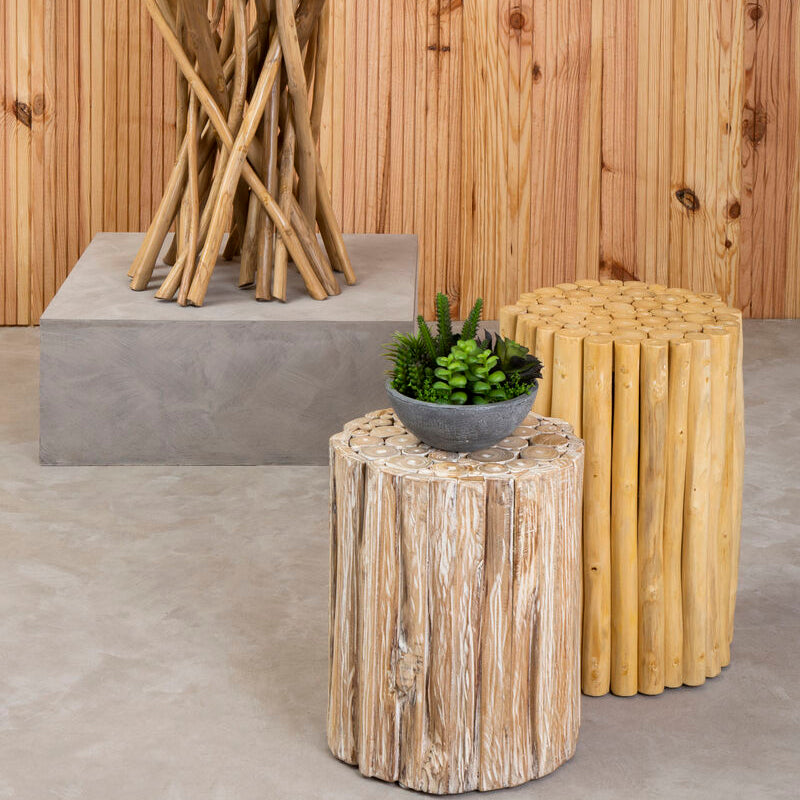 Decorative side table with natural wood and stone design against a wooden wall.
