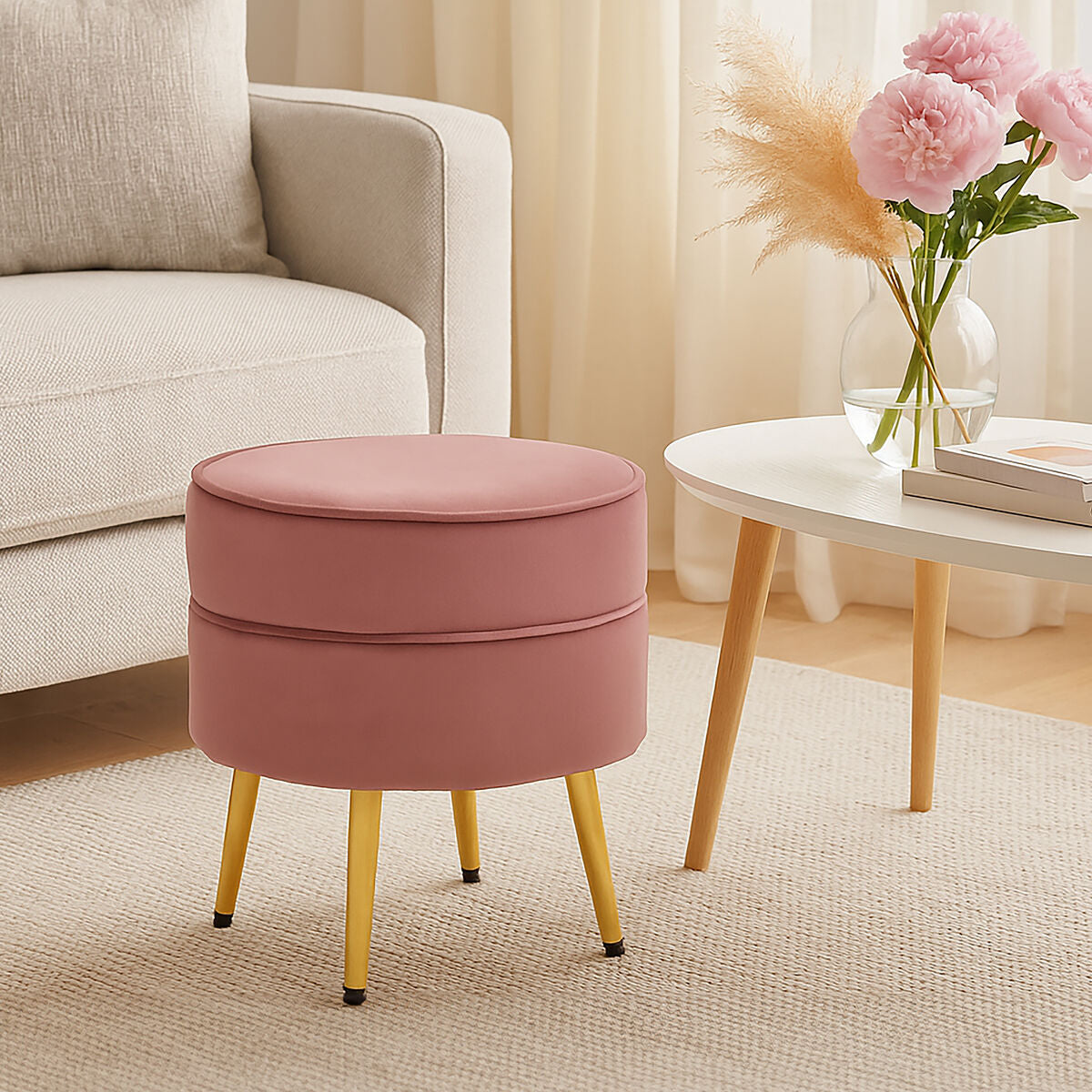 Pink ottoman with yellow legs in a living room setting