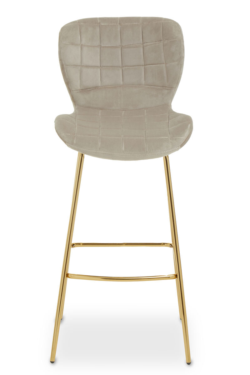 Bar stool with quilted beige seat and gold metal legs on a white background
