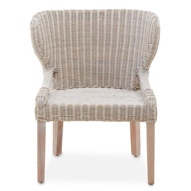 Wicker chair with a cushion on a white background