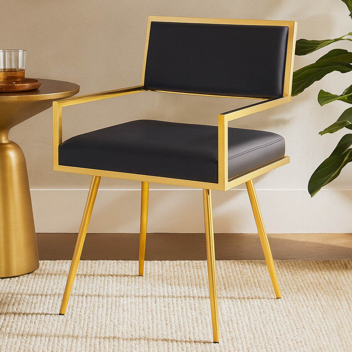 Black chair with gold frame in a room setting