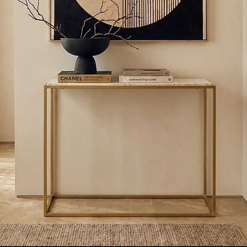 Modern interior with a console table, abstract wall art, and decorative items.