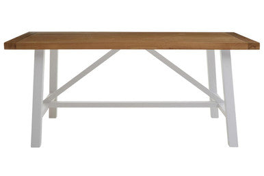 Wooden table with white metal legs on a white background