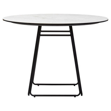 Round dining table with white marble top and black metal frame on a white background