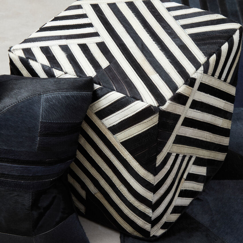 Black and white striped cushions on a neutral background