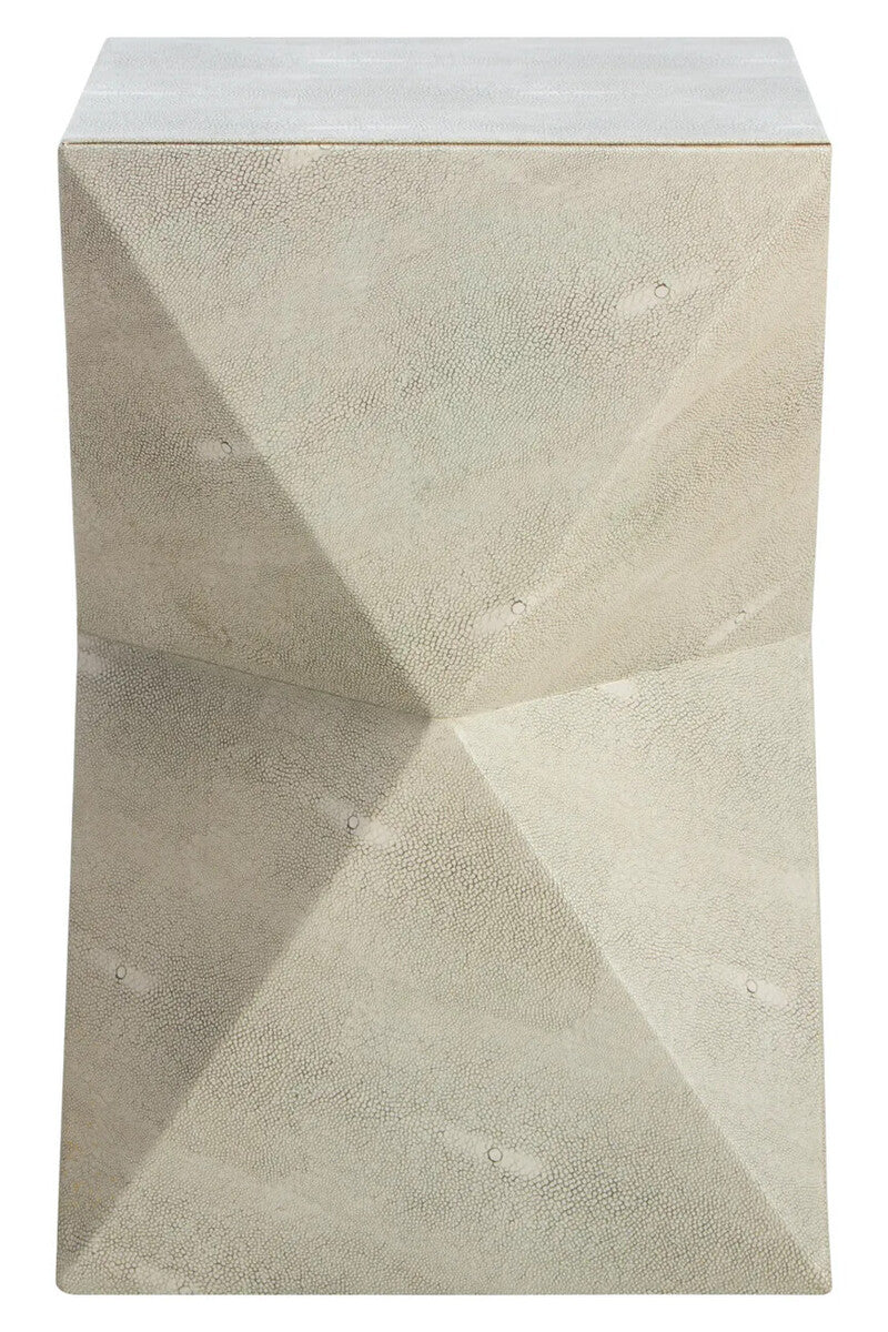 Geometric stone side table with a textured surface
