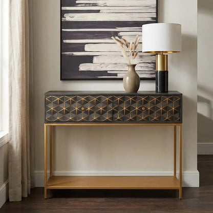 Console table with decorative items against a wall with abstract art