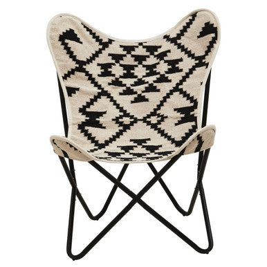 Butterfly chair with patterned seat and black metal frame on a white background
