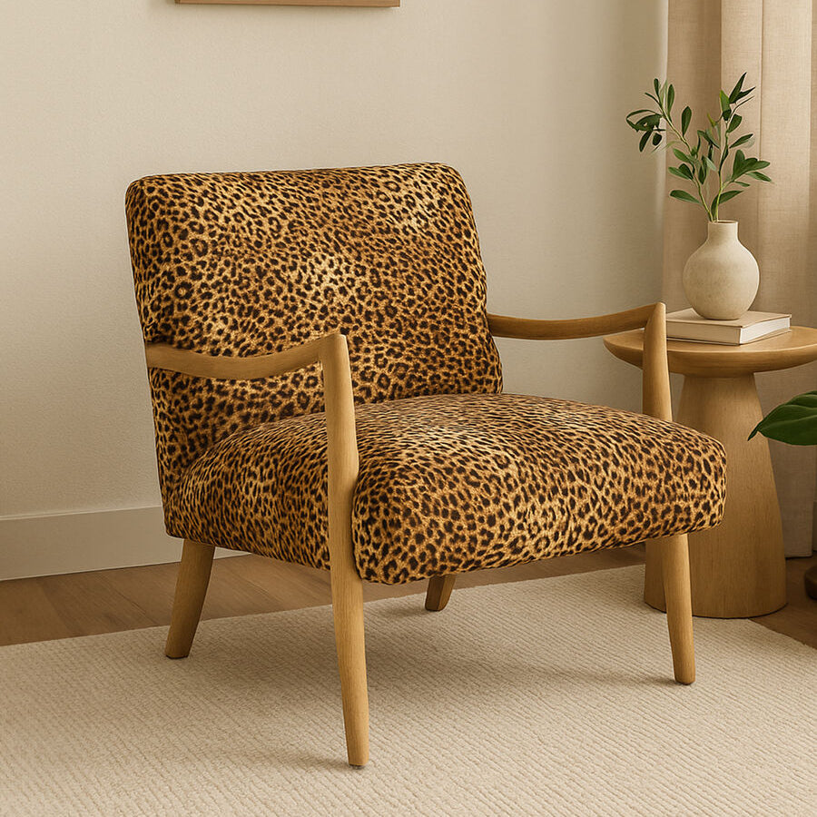 Leopard print armchair in a room with a side table and lamp.