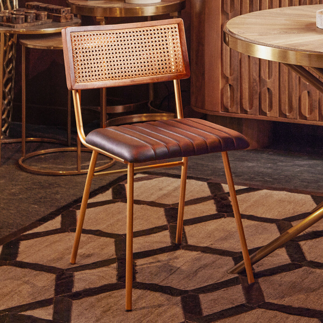 Wooden bar stool with woven backrest and leather seat in a stylish interior setting.
