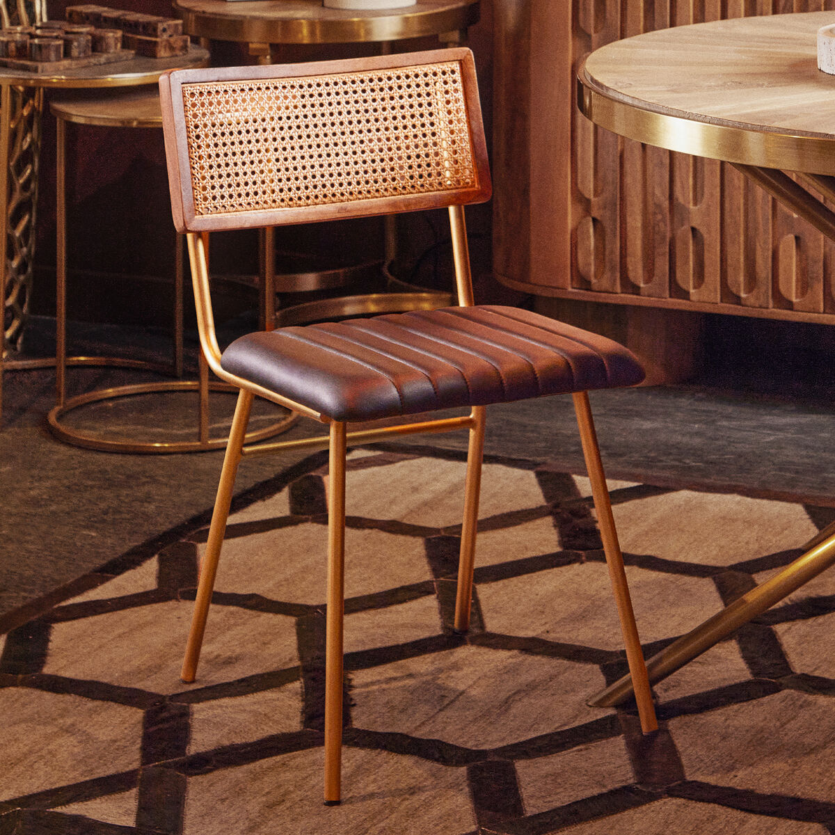 Wooden bar stool with woven backrest and leather seat in a stylish interior setting.