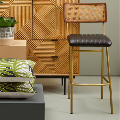 Wooden cabinet with decorative items and a chair in a room setting