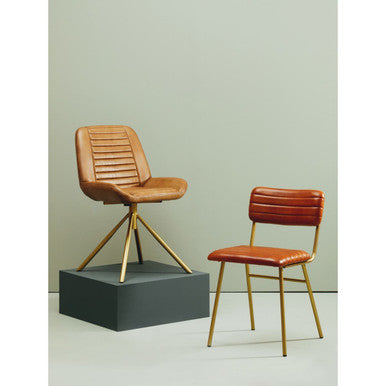 Two brown chairs with gold legs on a light green background