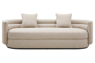 Beige sofa with two cushions on a white background