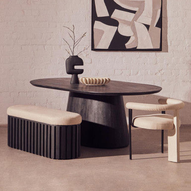 Modern dining room with a dark wooden table, chairs, and abstract art on the wall.