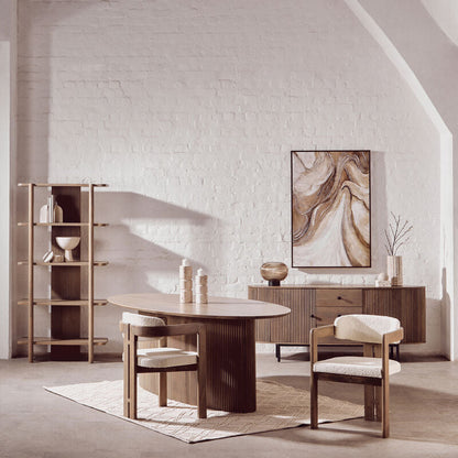 Modern dining room with wooden table and chairs, white walls, and a painting.