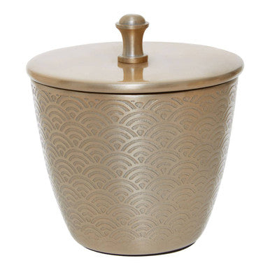 Decorative beige container with a textured pattern and gold lid on a white background