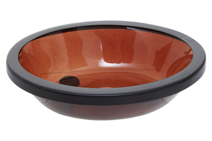 Round glass sink with red interior and black rim on a white background