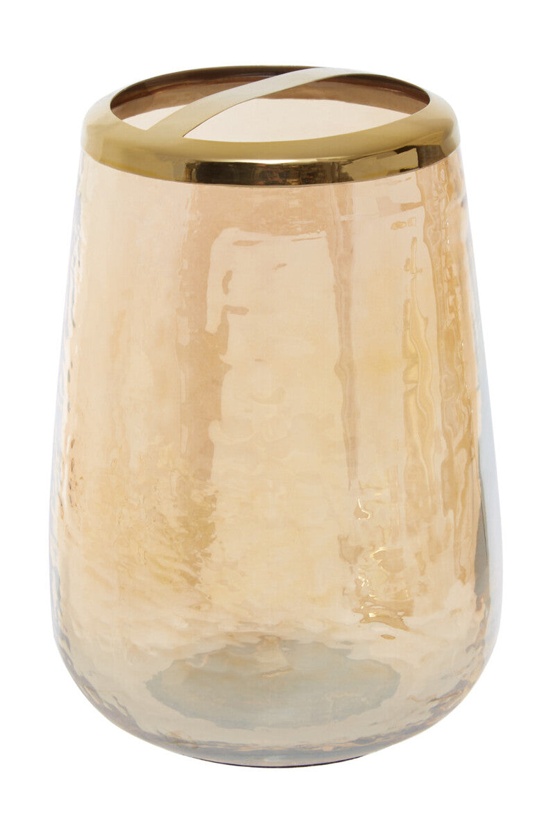 Glass candle holder with gold rim on a white background