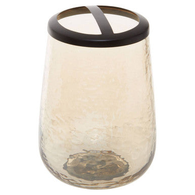 Glass candle holder with a black lid on a white background