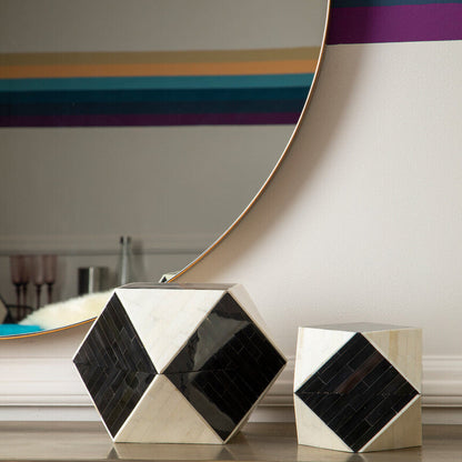 Decorative items on a wooden surface with a mirror in the background